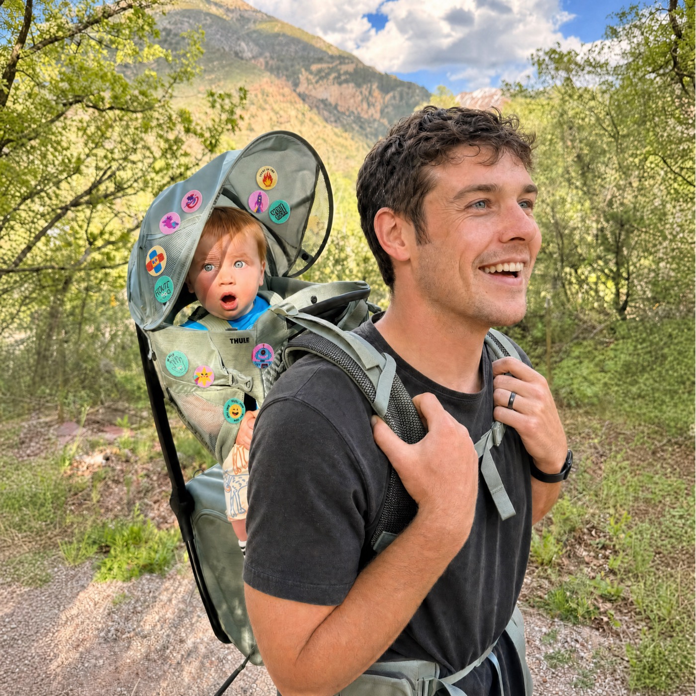 Dad hiking with baby wearing Luna Natural patches